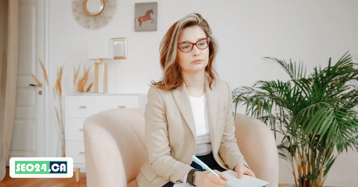 Therapist listening during a session in a calm, softly lit office, SEO24 therapist SEO in Toronto